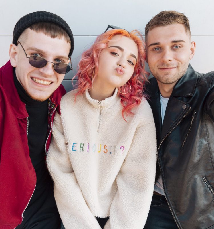 young-friends-taking-selfie-grimacing